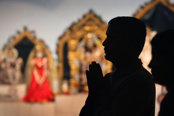 An unidentified Hindu man praying