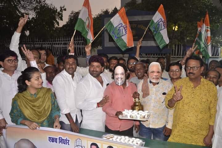 Congress celebrates election victory by wearing Amit Shah, Narendra Modi masks and distributing tea