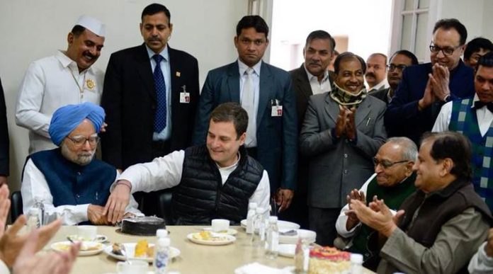 Rahul Gandhi and Manmohan Singh cutting cake
