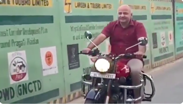 Watch: Delhi Deputy Chief Minister Manish Sisodia flouting traffic rules, caught riding bike without a helmet