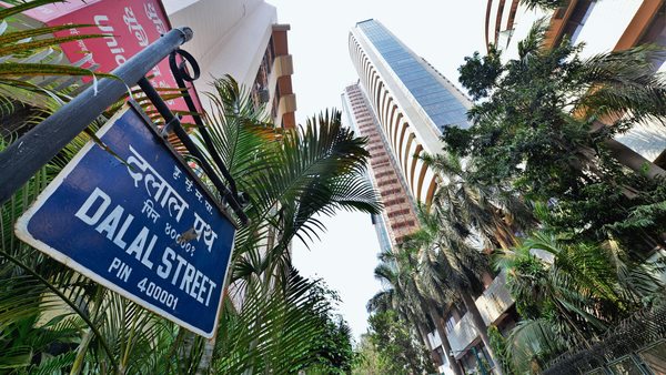Sensex surges over 900 points as exit polls predict a second term for Modi