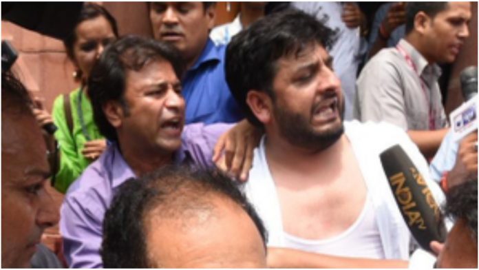 PDP MP marshalled out of the Lok Sabha after they try to tear the copies of Indian constitution
