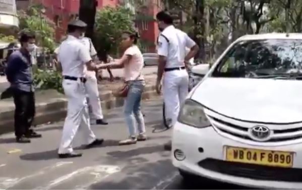 Watch: Kolkata girl abuses cop, spits on his uniform for stopping her car during the lockdown