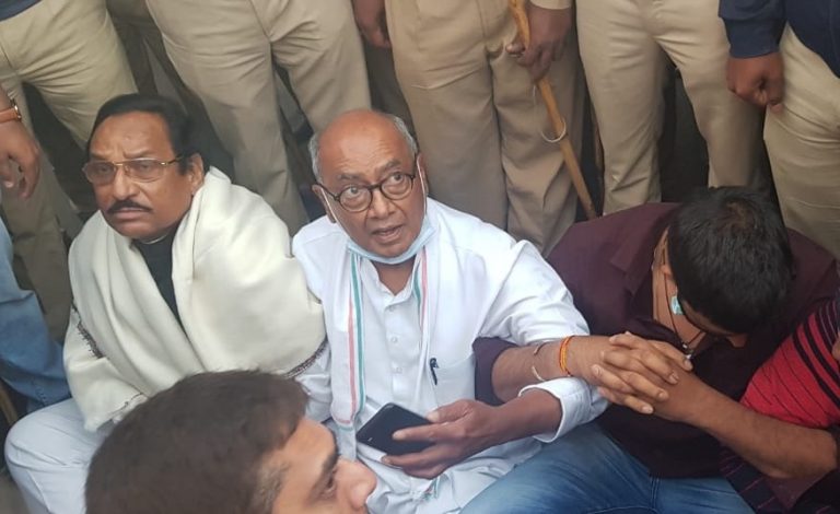 Watch: Police puts Digvijaya Singh under preventive arrest as he sat on a dharna outside Bengaluru hotel to meet Madhya Pradesh MLAs