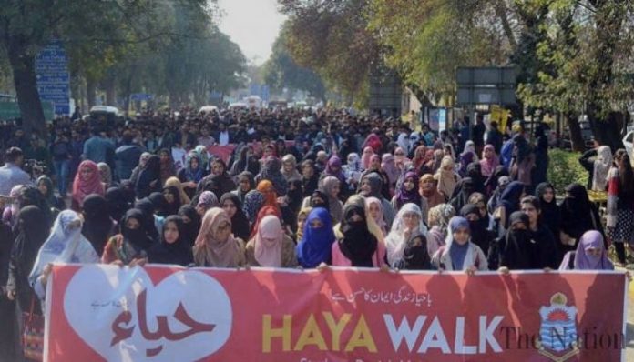 Burkha Clad Women protests against Aurat March that aims to secure them 