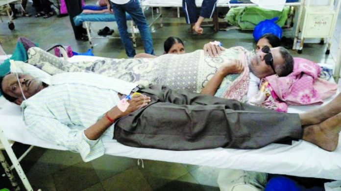 Mumbai's healthcare system faces the pressure as reports say patients are being made to share beds