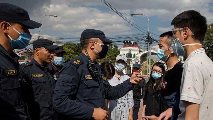 Chinese citizens stranded in Nepal ape their Communist government in China, resort to bullying and stone-pelting to get their demands fulfilled