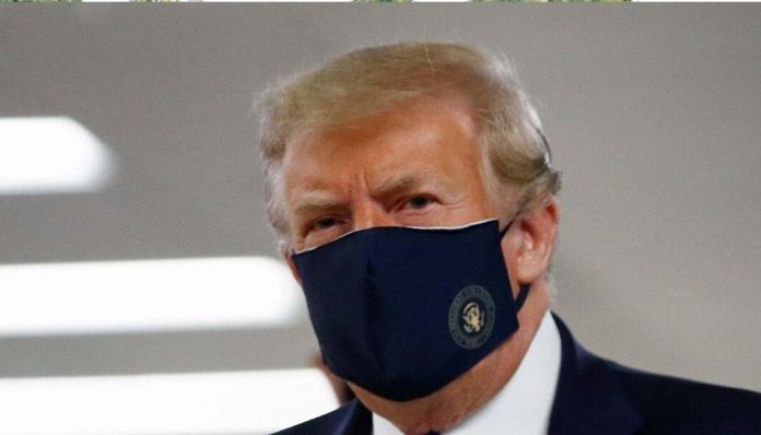 Donald Trump makes first public appearance with a face covering