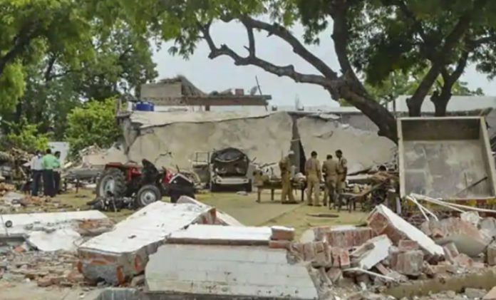 Police say large quantities of arms and ammunition found in a bunker and walls of Vikas Dubey's house
