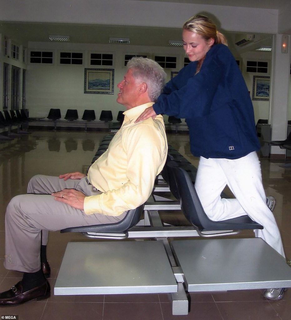 Bill Clinton receives neck massage from the victim of disgraced pedophile Jeffery Epstein.