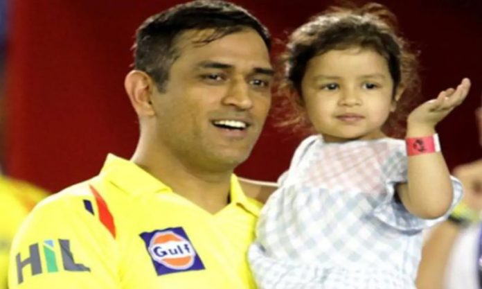 Dhoni with his daughter