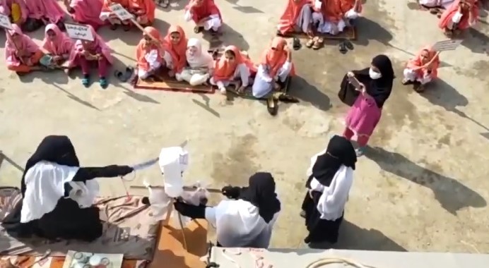 Islamabad female teacher beheading effigy of Emmanuel Macron