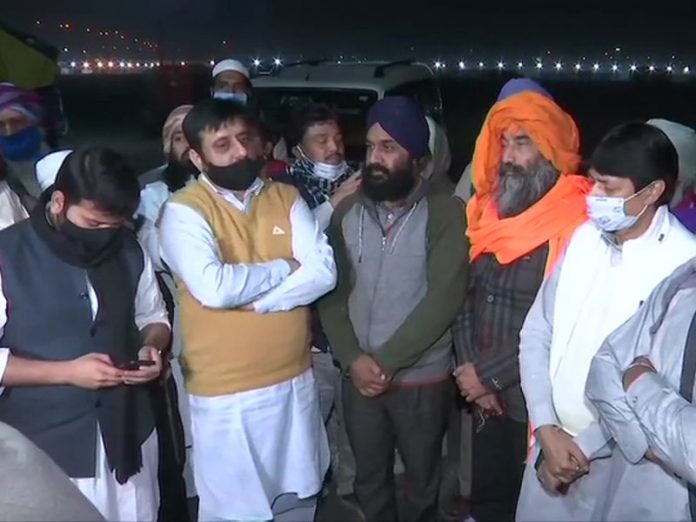 Amanatullah Khan with protesters