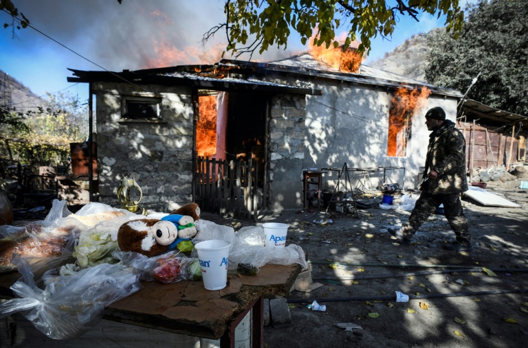 ‘We also moved our parents’ graves, they will take pleasure in desecrating our graves’: Armenians burn their houses as Muslim majority Azerbaijan takes over