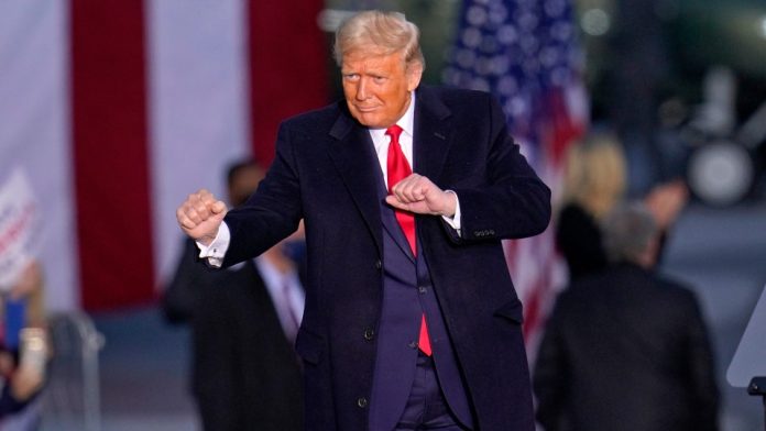 Donald Trump dances at a rally