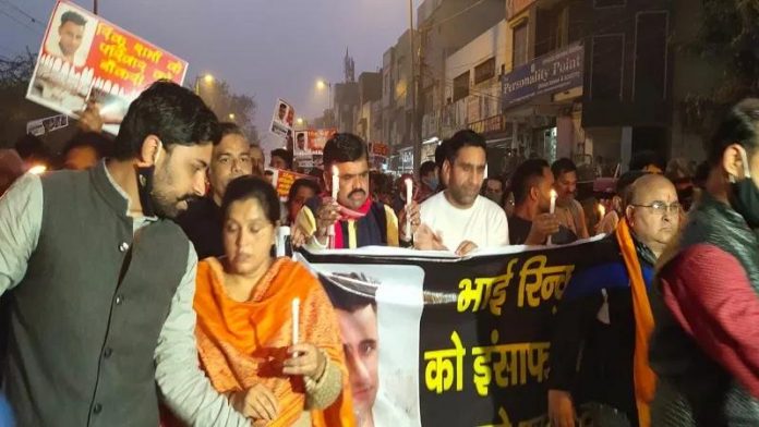 Residents of Mangolpuri area carry out a march to demand justice for Rinku Sharma