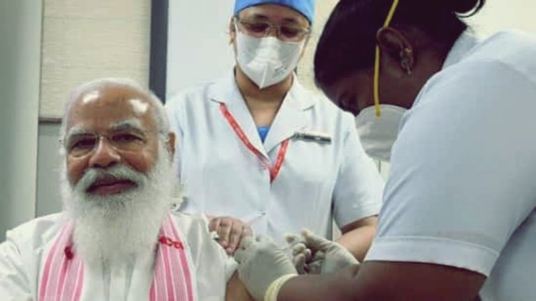 Assamese gamosa, South-Indian nurse and Bharat-made COVAXIN: PM Modi’s vaccine symbolism is bound to burn ‘liberals’