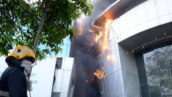 A firefighter attempting to douse fire that broke out at the Sunrise Hospital
