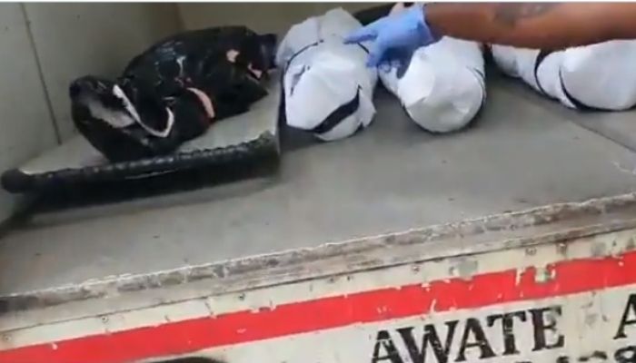 Maharashtra: Viral video shows corpses of Covid patients wrapped in garbage bag and polythene being taken for cremation