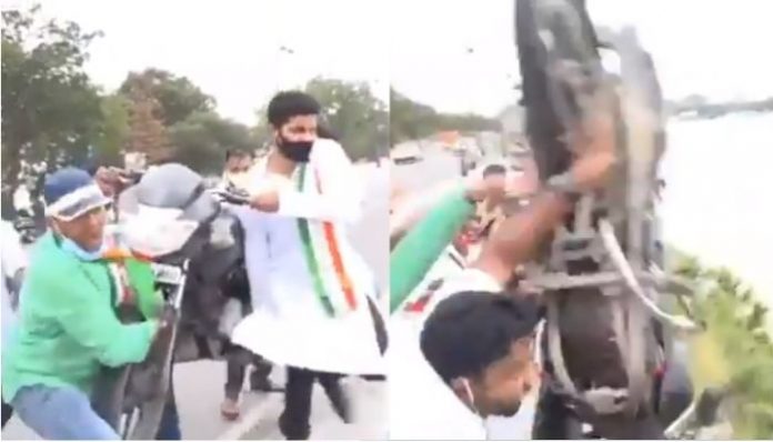 Youth Congress workers throw bike into lake to protest against Modi government: Watch and know why