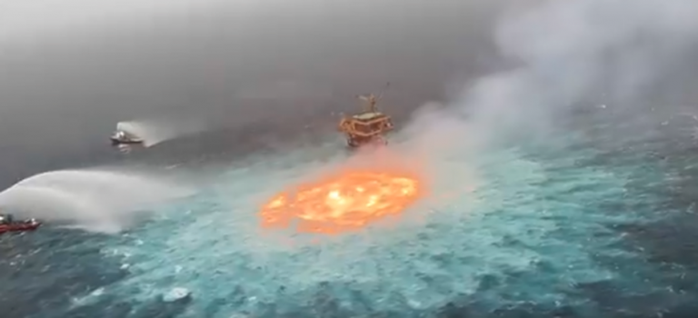Boats spray water on the sea at the Gulf of Mexico after gas leakage causes pipelines to catch fire, leaves netizens puzzled