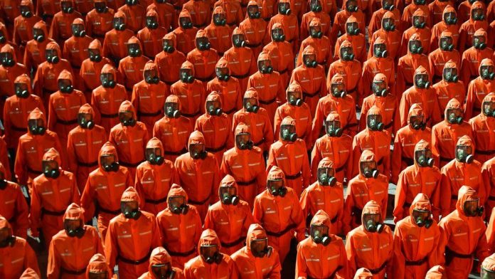 Even as North Korea claims victory over COVID, military parade features hazmat suits, gas masks, as economic crisis due to pandemic worsens