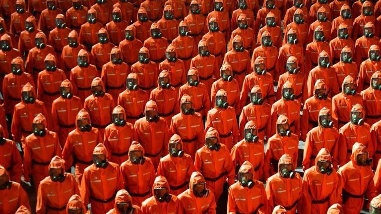 Even as North Korea claims victory over COVID, military parade features hazmat suits, gas masks, as economic crisis due to pandemic worsens