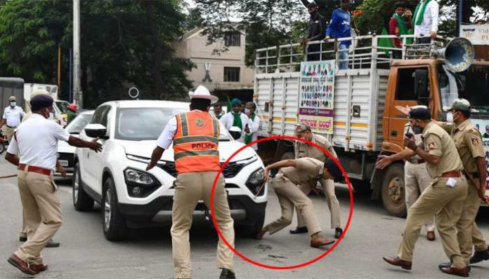 Bharat Bandh: Protesters stop army vehicles from moving, one protester runs over Bengaluru DCP's feet with a car