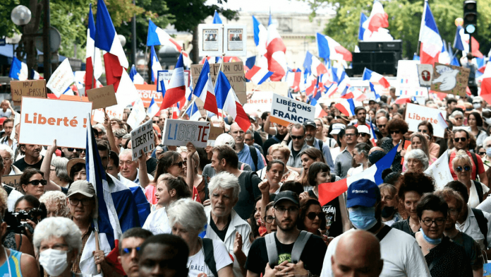 Watch: Citizens of France protest against Macron's vaccine passport mandate, chant 'freedom', force police to retreat