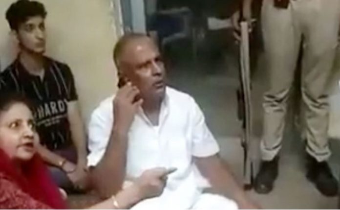 Congress MLA Meena Kanwar and her husband at police station
