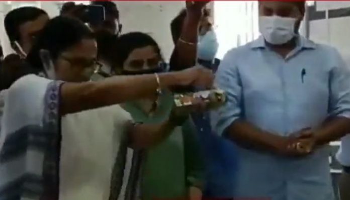 Mamata Banerjee throws Charnamrit on floor