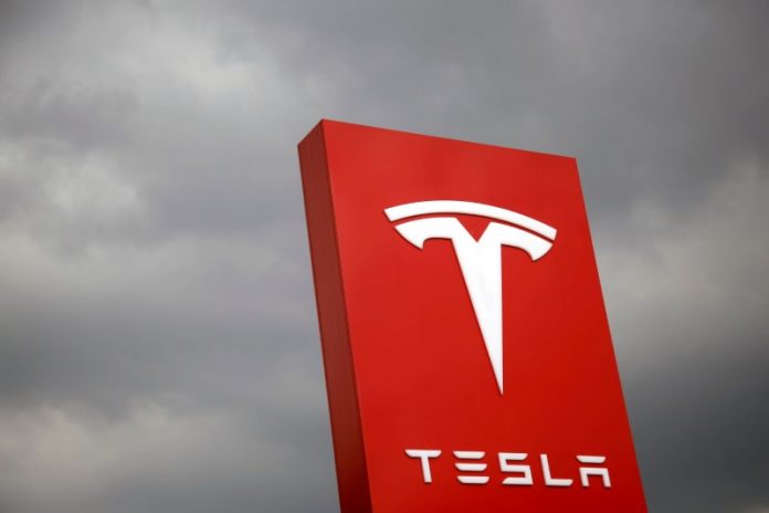 Female employee sues Tesla