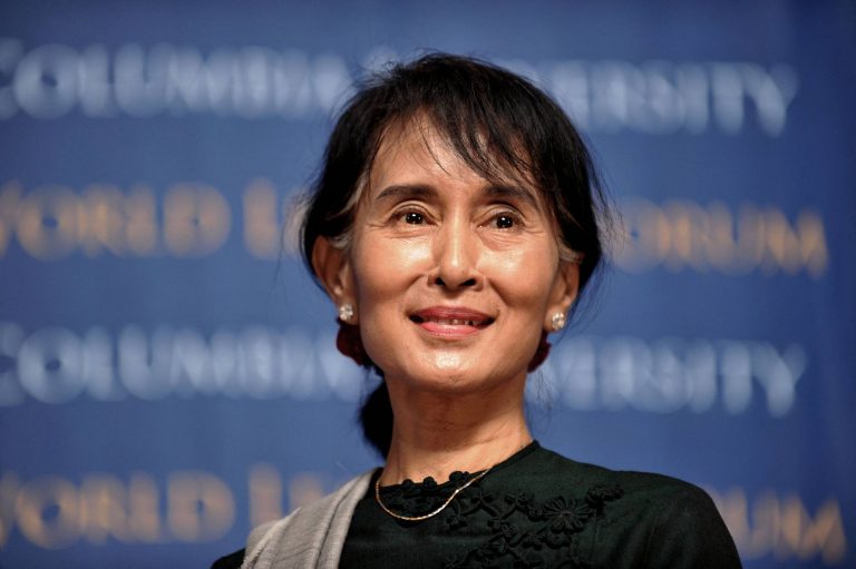 Aung Suu Kyi, democratic leader of Myanmar jailed for 2 years, appears in court dressed as a prisoner