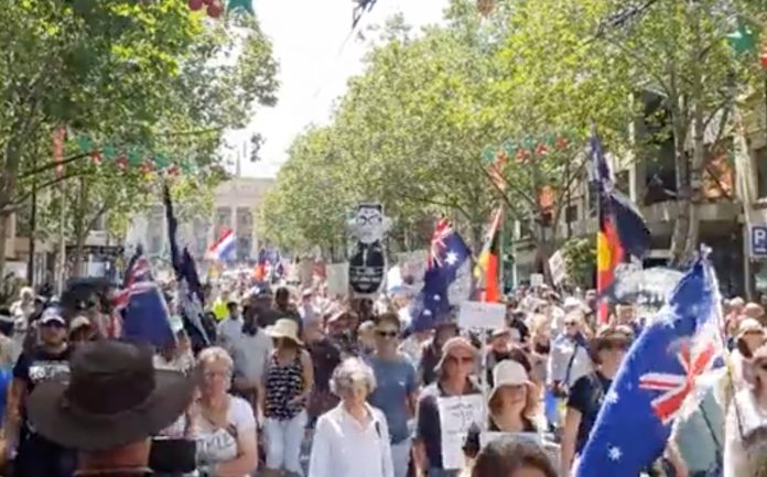 Massive crowds throng the streets of Australian cities against COVID-19 restrictions