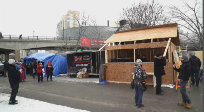 Canadian truckers build temporary structures on lines with farmers' protest