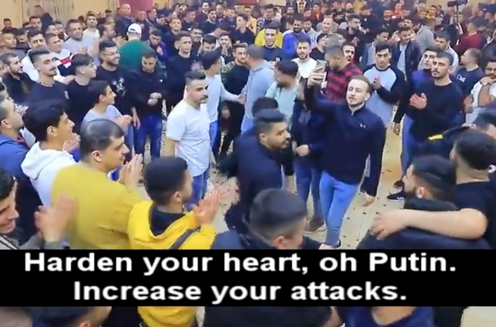 Palestinian rejoice and dance as singers call on Putin to attack Ukraine