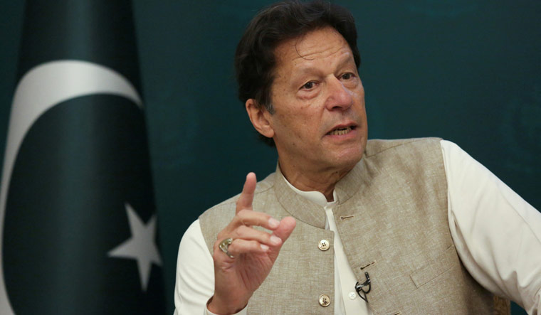 Facing rebellion at home, a beleaguered Imran Khan seeks refuge in religion to save his chair