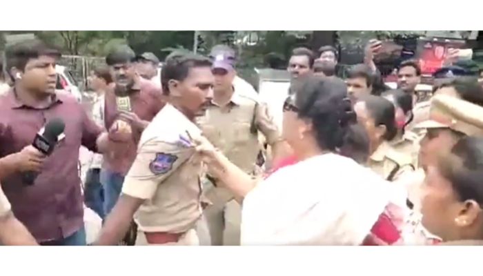 Hyderabad: Congress leader Renuka Chowdhury grabs the collar of a police officer on duty in the AICC protests against ED