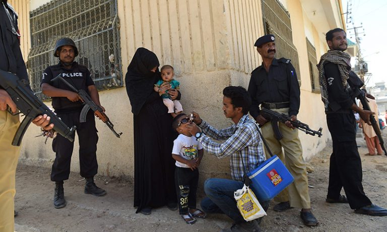Two policemen guarding polio vaccinators shot dead in Pakistan; the country remains one of the last hurdles to eradication of polio