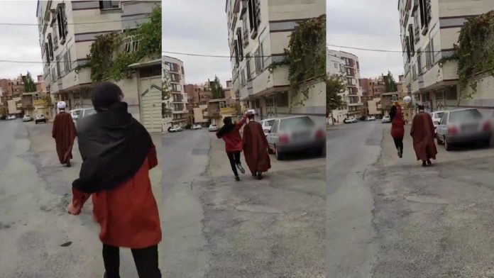 Anti-hijab protestors in Iran knock off turbans of Islamic clerics