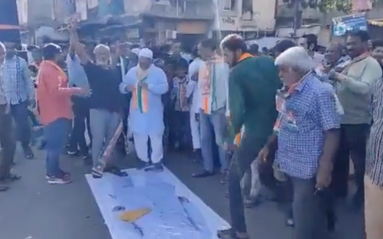 Gujarat elections: Muslim voters dance on posters of Asaduddin Owaisi after defeating the AIMIM candidate in Ahmedabad’s Jamalpur