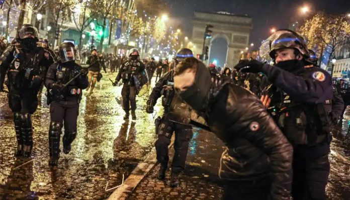 Riot police controlling angry French Fans