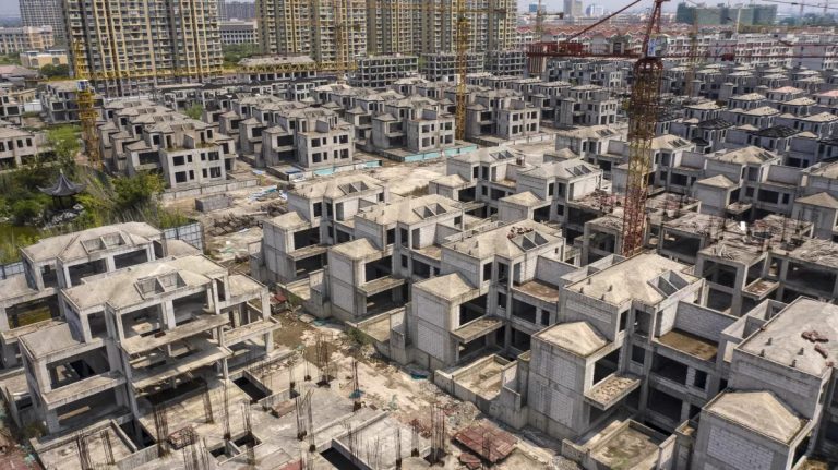 China faces a massive financial crisis as thousands of apartment projects remain incomplete and homebuyers refuse to repay mortgages