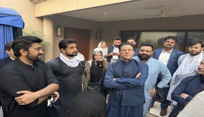 Imran Khan accompanied by his supporters in Zaman Park.