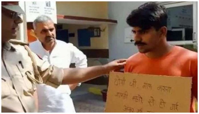 ‘Forgive me Yogi ji, I made a mistake:’ fearing encounter, wanted criminal in UP reaches police station with a placard to surrender
