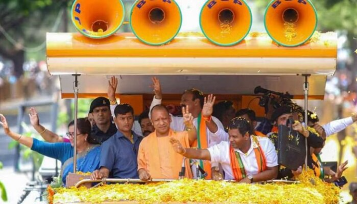 In Mandya, ahead of the impending Karnataka Assembly elections, the CM of UP flashes the victory sign.