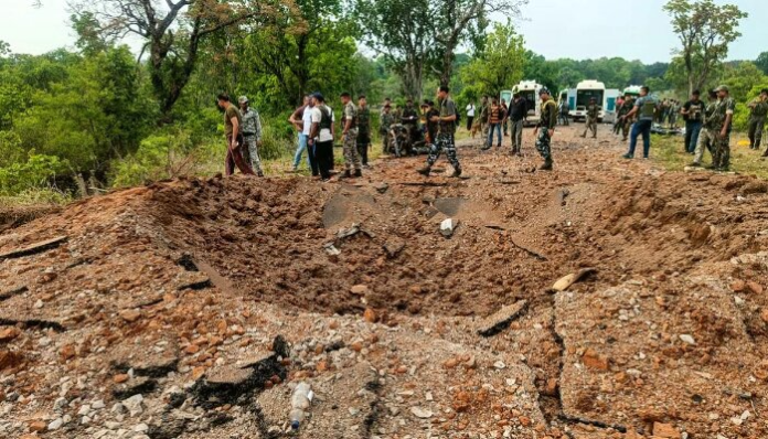 Security personnel at the scene after a Maoist blast on April 26, 2023, in Chhattisgarh's Dantewada district claimed the lives of at least 10 DRG personnel and a driver.