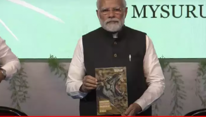 The PM launching, 'Amrit kaal ka vision for tiger conservation,' at the event.
