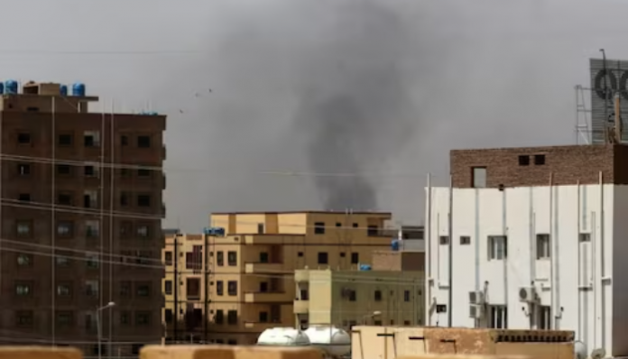 Following the clashes, smoke is seen rising above buildings in Khartoum.
