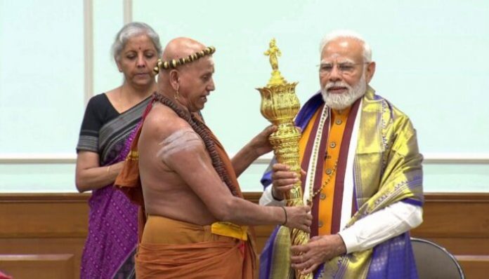 Sri Harihara Desika Swamigal presenting Sengol to Prime Minister Narendra Modi.